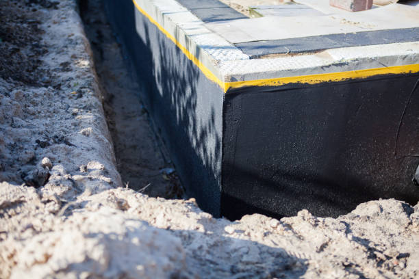 Professional Basement Waterproofing technician working in Cleveland, WI